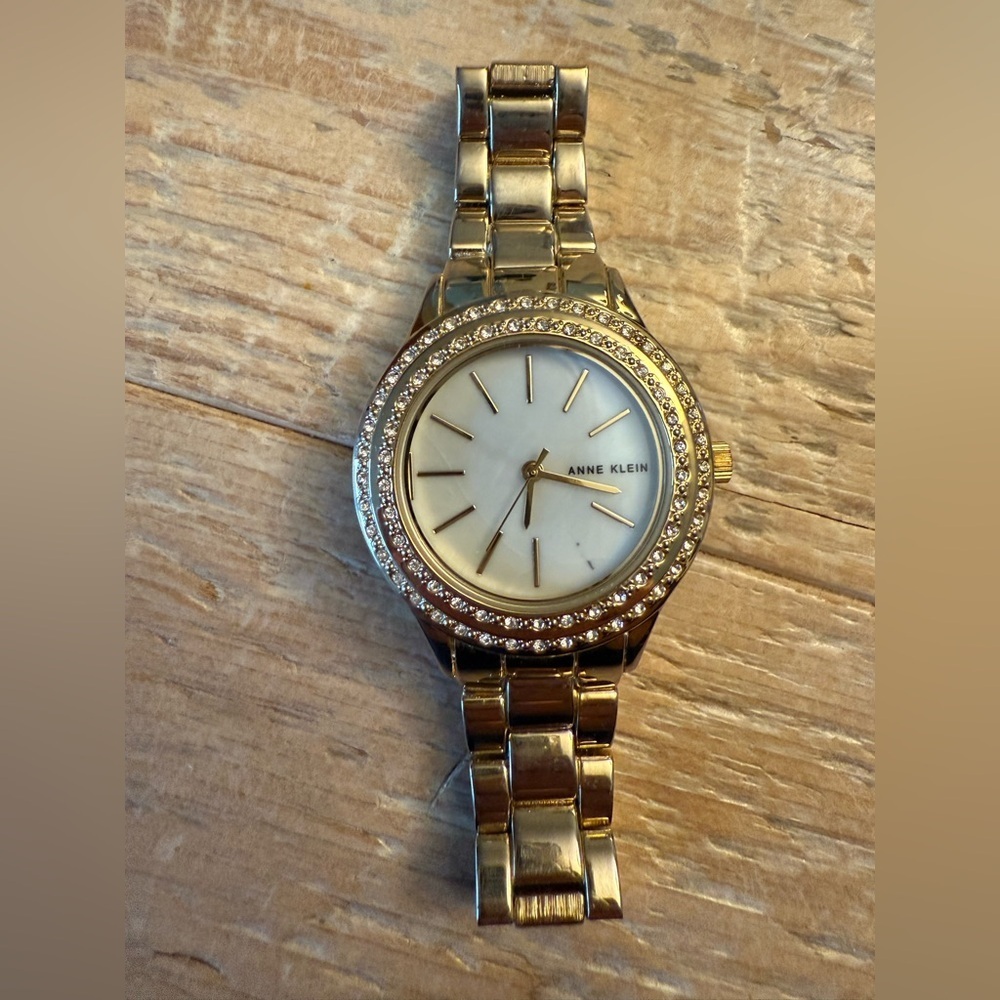 Anne Klein Gold-Tone Crystal Bezel Women's Watch with Mother-of-Pearl Dial